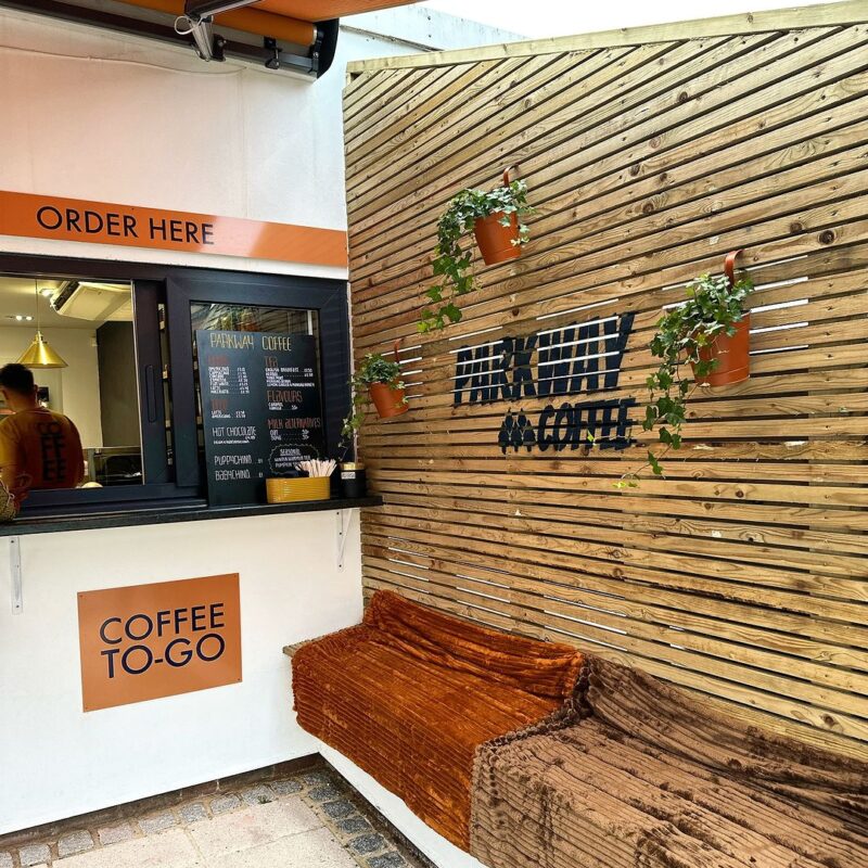 fence with plants outside the coffee hatch